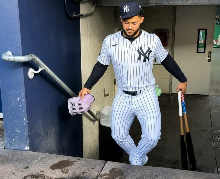 Yankees' Jasson Dominguez is making acomic walkthrough as he clim stairs at Yankee Stadium, 2025.