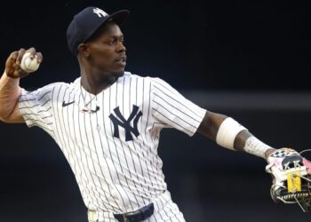 New York Yankees' Jazz Chisholm Jr. throws the ball before the start of MLB baseball game against the Boston Red Sox, Sunday, June 8, 2025, in New York.