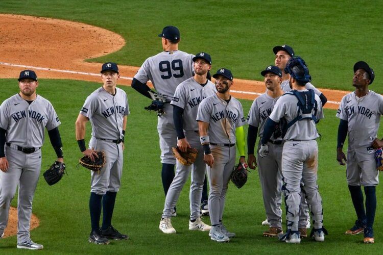 The Yankees players are looking at a replay during the 3-2 nail-biter win over the Rangers in Texas on Apr. 28, 2026.