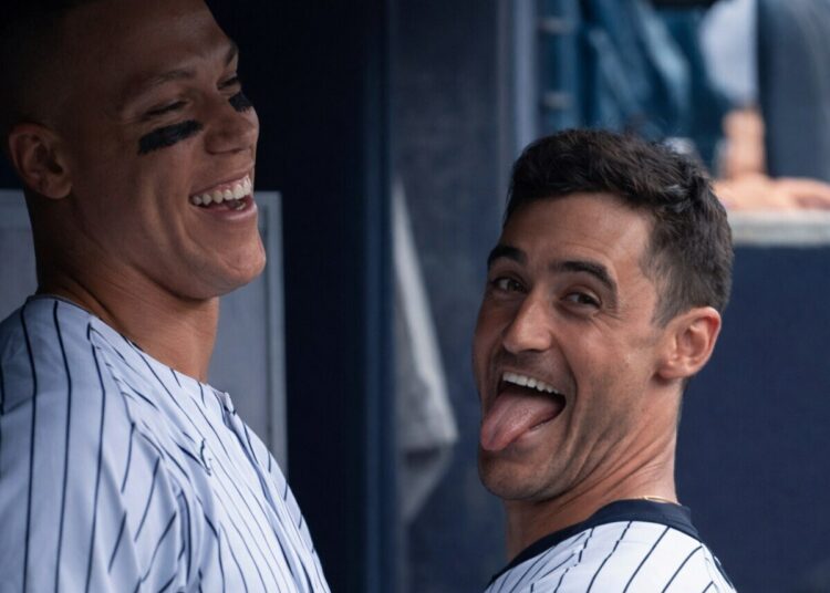 Aaron Judge and Cody Bellinger enjoy a lighter moment at dugout in the Yankees' 7-0 win over the Royals in New York, Apr. 19, 2026.