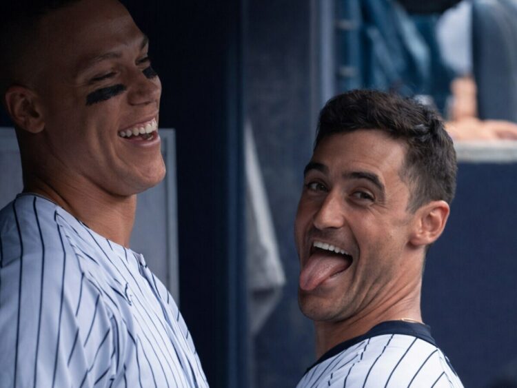 Aaron Judge and Cody Bellinger enjoy a lighter moment at dugout in the Yankees' 7-0 win over the Royals in New York, Apr. 19, 2026.