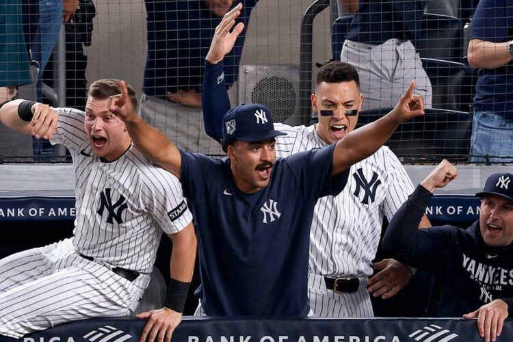 The Yankees dugout celebrates as Jose Caballero's walk-off double capped a wild 5-4 Yankees win over the Angels in New York, Apr. 15, 2026.