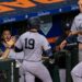 Ryan McMahon celebrates in dugout after his home run in the Yankees' 12-4 win over the Astros in Houston.