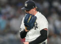 New York Yankees pitcher Ryan Weathers yells into his glove as he walks to dugout during the second inning of a baseball game against the Los Angeles Angels, Tuesday, April 14, 2026, in New York.
