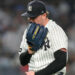 New York Yankees pitcher Ryan Weathers yells into his glove as he walks to dugout during the second inning of a baseball game against the Los Angeles Angels, Tuesday, April 14, 2026, in New York.