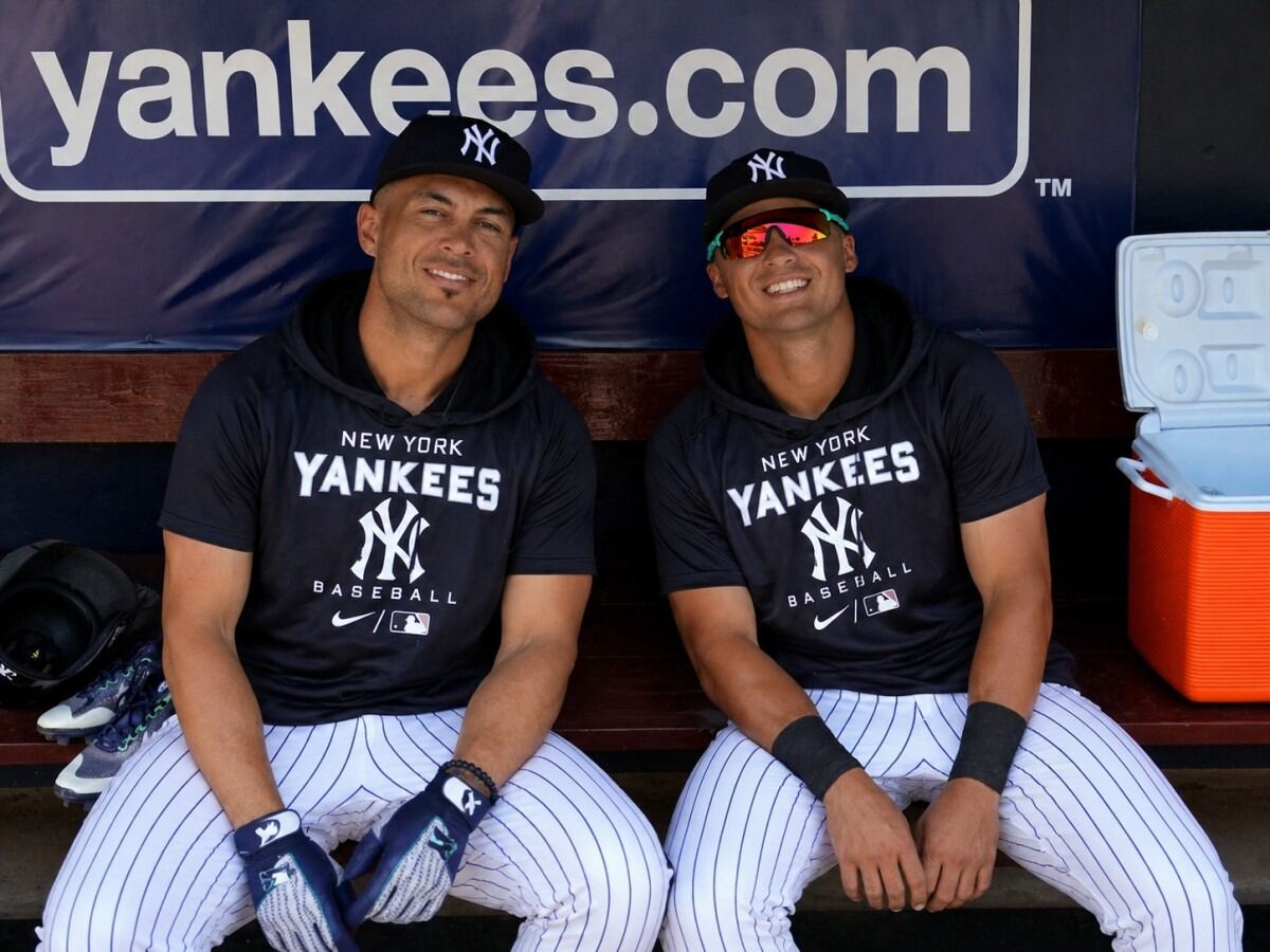 New York Yankees' Giancarlo Stanton and Anthony Volpe in dugout during the 2026 spting training camp. Tampa, FL.