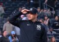 Aaron Boone salutes as the famous phrase of John Sterling was played as a tribute after the Yankees 12-1 win over the Orioles. May 4. 2026, New York.