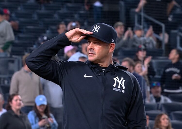Aaron Boone salutes as the famous phrase of John Sterling was played as a tribute after the Yankees 12-1 win over the Orioles. May 4. 2026, New York.