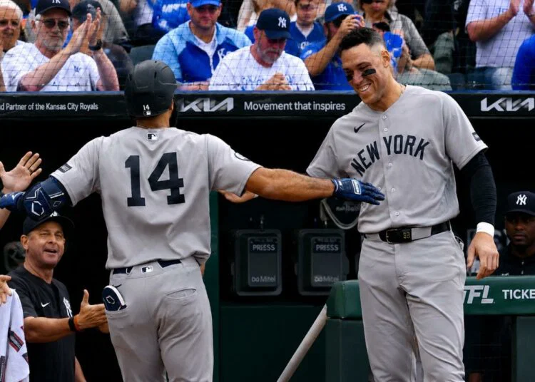 Aaron Judge was with Amed Rosario after latter's second home run in the Yankees' 15-1 win over the Royals, Kansas City, May 26, 2026.