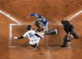 Anthony Volpe avoids tagging at home plate to score a run in the Yankees' 7-6 win over the Blue Jays, New York, May 18, 2025.