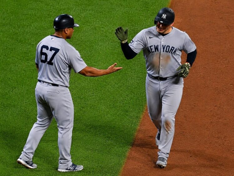 Ben Rice celebrates with Luis Rojas after his home run in the Yankees' 5-2 win over the Mets in New York, May 15, 2026.