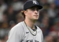 New York Yankees’ Cam Schlittler walks to the dugout during the first inning of a baseball game against the Milwaukee Brewers, Saturday, May 9, 2026, in Milwaukee.