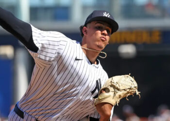 New York Yankees pitcher Carlos Lagrange #84, throwing a warmup pitch before the start of the 2nd inning.