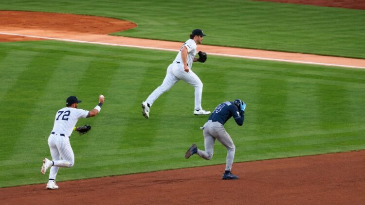 Yankees' Gerrit Cole picked off Rays' Simpson and teamed up with Caballero and McMahon to toss the rival runner at third in 4-2 loss in New York, May 22, 2026.