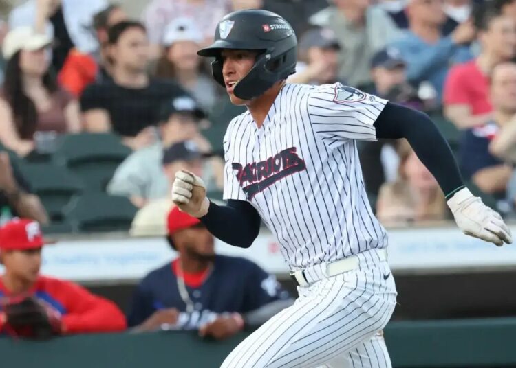 Somerset Patriots shortstop George Lombard Jr. scores during a game against the Reading Fightin’ Phils.