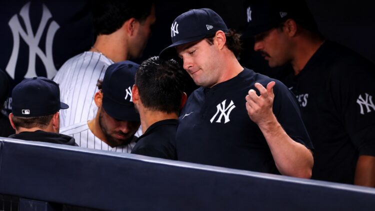Gerrit Cole reacts in the dugout