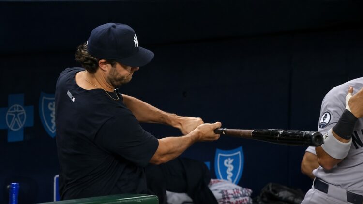 Gerrit Cole practices with a bat in the dugout during the Yankees' 15-1 win over the Royals, Kansas City, May 26, 2026.