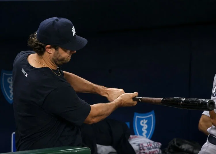 Gerrit Cole practices with a bat in the dugout during the Yankees' 15-1 win over the Royals, Kansas City, May 26, 2026.