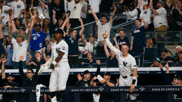 Aaron Judge celebrates after Jazz Chishol Jr. hit a go-ahead home run in the Yankees'