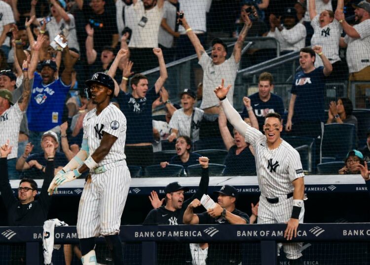 Aaron Judge celebrates after Jazz Chishol Jr. hit a go-ahead home run in the Yankees'