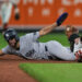 New York Yankees’ José Caballero, left, is caught by Baltimore Orioles second baseman Blaze Alexander, right, while trying to steal second base during the ninth inning of a baseball game, Monday, May 11, 2026, in Baltimore.