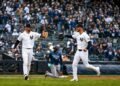 Yankees' Ryan McMahon and Cody Bellinger celebrate after throwing Rays' Junior Caminero at third base in New York’s 2-0 win on May 24, 2026.