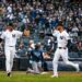 Yankees' Ryan McMahon and Cody Bellinger celebrate after throwing Rays' Junior Caminero at third base in New York’s 2-0 win on May 24, 2026.