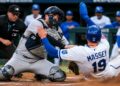 Austin Wells tags Michael Massey at home plate on a throw from Aaron Judge in the Yankees' 7-0 win over the Royals, Kansas City, May 27, 2026.