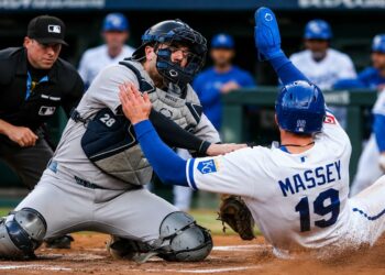 Austin Wells tags Michael Massey at home plate on a throw from Aaron Judge in the Yankees' 7-0 win over the Royals, Kansas City, May 27, 2026.