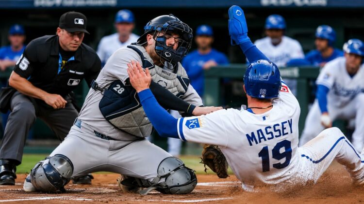 Austin Wells tags Michael Massey at home plate on a throw from Aaron Judge in the Yankees' 7-0 win over the Royals, Kansas City, May 27, 2026.