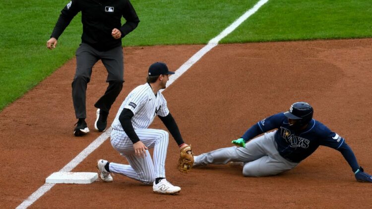 Yankees' Ryan McMahon tags out Rays runner Junior Caminero at third base on Cody Bellinger’s heads-up throw during New York’s 2-0 win on May 24, 2026.