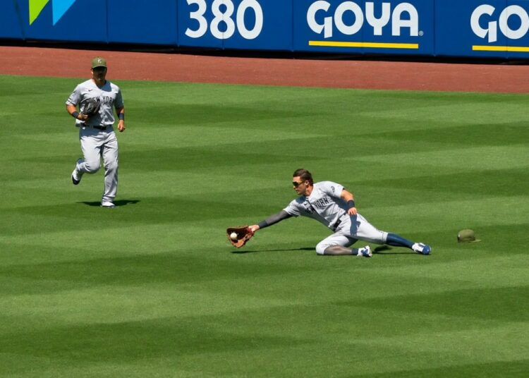 Trent Grisham watches as Spencer Jones makes a near-impossible catch during the Yankees' 7-6 loss to the Mets, New York, May 17, 2026.