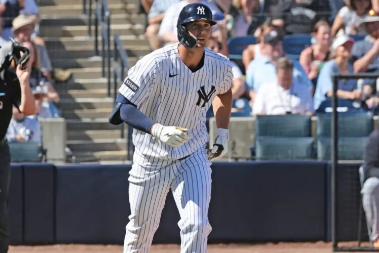 Yankees center fielder Spencer Jones hitting a solo homer during spring training.