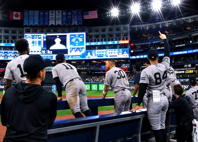 The Yankees dugout erupts in celebration after Ben Rice's go-ahead home run in the ninth in the Yankees' 8-3 win over the Blue Jays, Toronto, June 14, 2026.