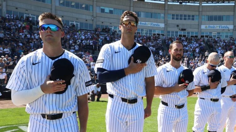 Max Schuemann, Spencer Jones, Paul DeJong, and Seth Brown are at a 2026 Yankees spring training game.