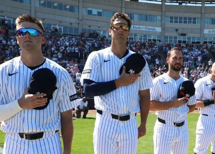 Max Schuemann, Spencer Jones, Paul DeJong, and Seth Brown are at a 2026 Yankees spring training game.