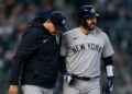 Yankees manager Aaron Boone and catcher Austin Wells together after an on-road win in April, 2026.