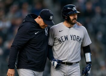 Yankees manager Aaron Boone and catcher Austin Wells together after an on-road win in April, 2026.