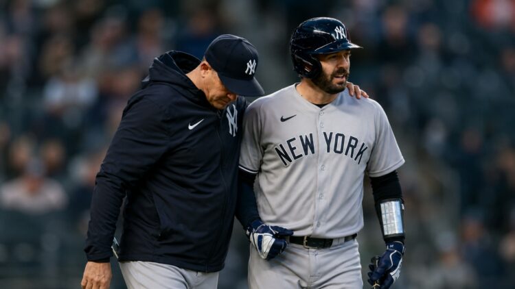 Yankees manager Aaron Boone and catcher Austin Wells together after an on-road win in April, 2026.