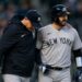 Yankees manager Aaron Boone and catcher Austin Wells together after an on-road win in April, 2026.