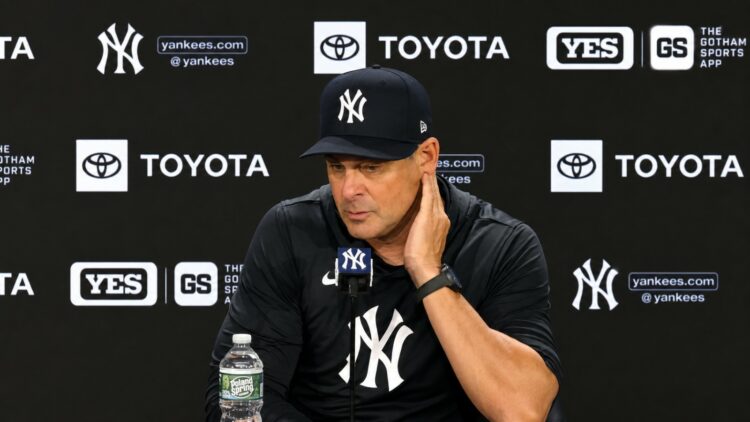 Manager Aaron Boone talks to the press after