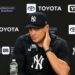 Manager Aaron Boone talks to the press after