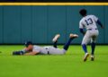 Aaron Judge dives to avoid getting in the way of Jazz Chisholm's catch on April 26, 2026 in Houston, Texas.