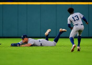 Aaron Judge dives to avoid getting in the way of Jazz Chisholm's catch on April 26, 2026 in Houston, Texas.