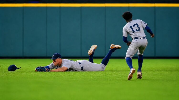 Aaron Judge dives to avoid getting in the way of Jazz Chisholm's catch on April 26, 2026 in Houston, Texas.