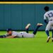 Aaron Judge dives to avoid getting in the way of Jazz Chisholm's catch on April 26, 2026 in Houston, Texas.