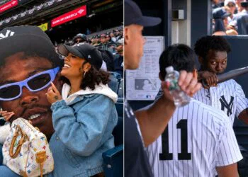 Fiancee Ahna Mac cheers him as Jazz Chisholm Jr. kisses Aaron Judge's bat in the dugout during the Yankees' 6-1 rout of the Red Sox in New York, June 7, 2026.