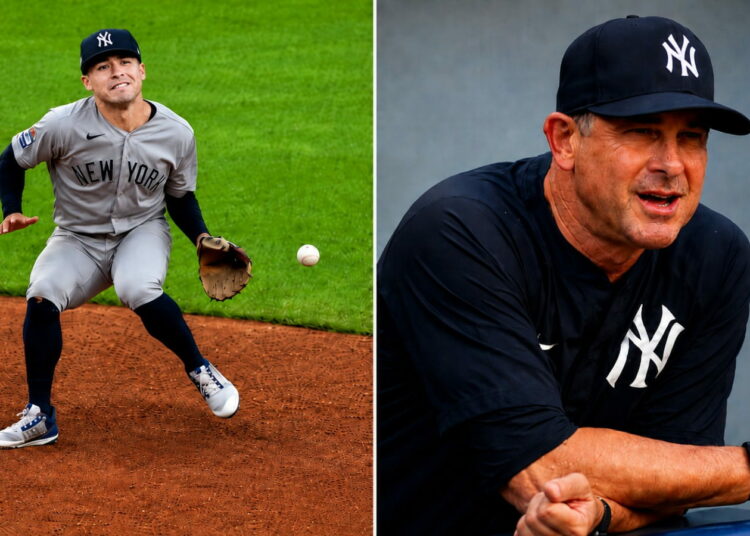 Manager Boone reacts to Anthony Volpe's error during the third inning in the Yankees' 3-2 win over the Guardians in Cleveland, June 9, 2026.