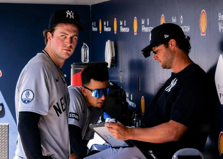 Cam Schlittler is with Gerrit Cole in the dugout after 7-inning gem in the Yankees' 3-1 win over the Blue Jays, Toronto, June 13, 2026.