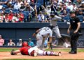 Jazz Chisholm celebrates after Trent Grisham slides into the plate in the sixth in the Yankees' 8-4 win over the Guardians in Cleveland, June 10, 2026.